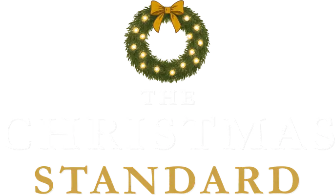 The Christmas Standard logo, a lit Christmas wreath with a gold bow above the name